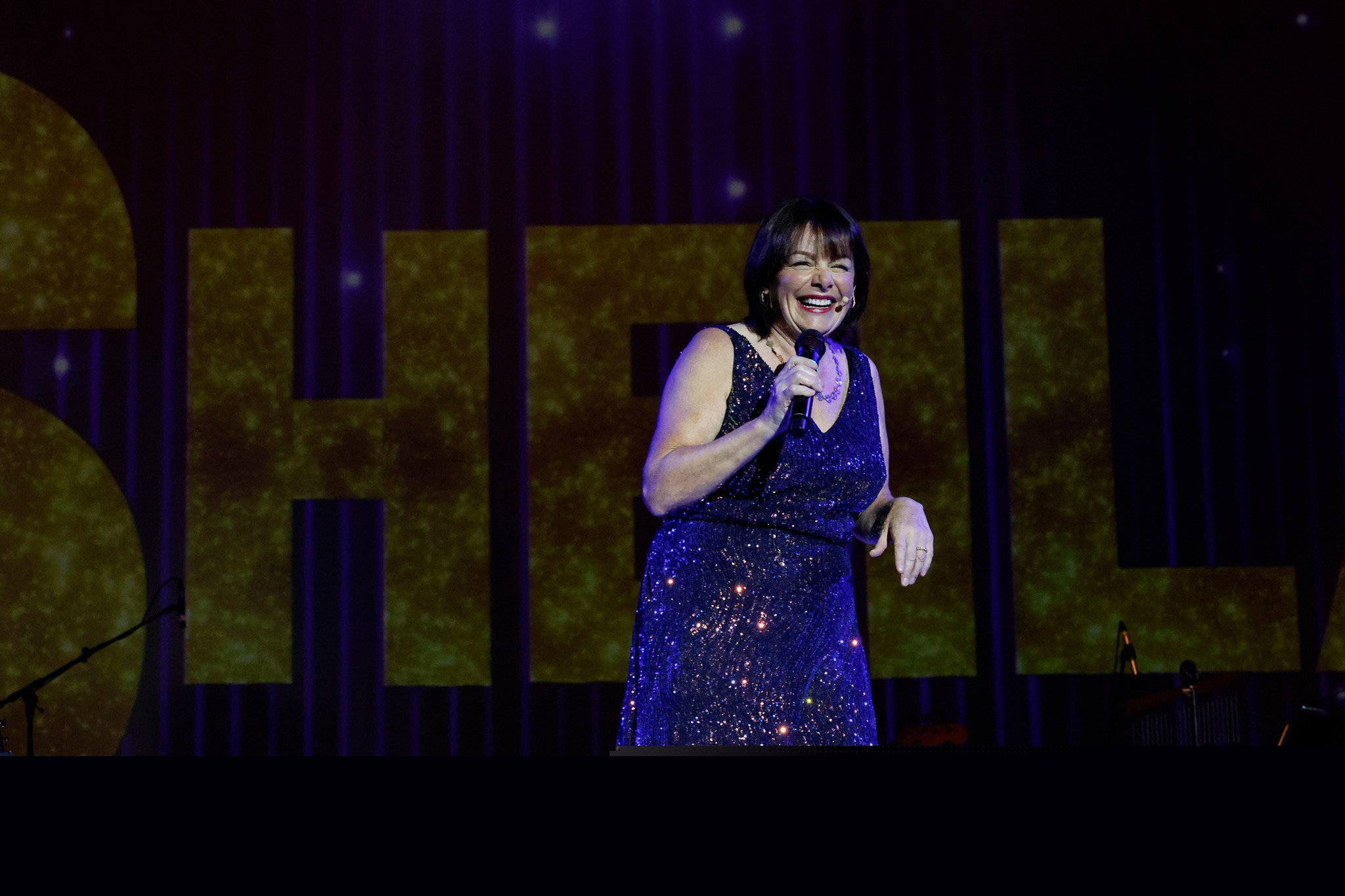 Sheila Williams laughing during a comedy performance
